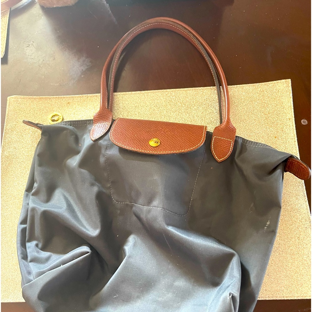 Longchamp small navy le piliage bag /well loved condition. Does show corner wear